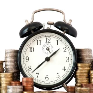 time is money concept alarm clock lots euro coins